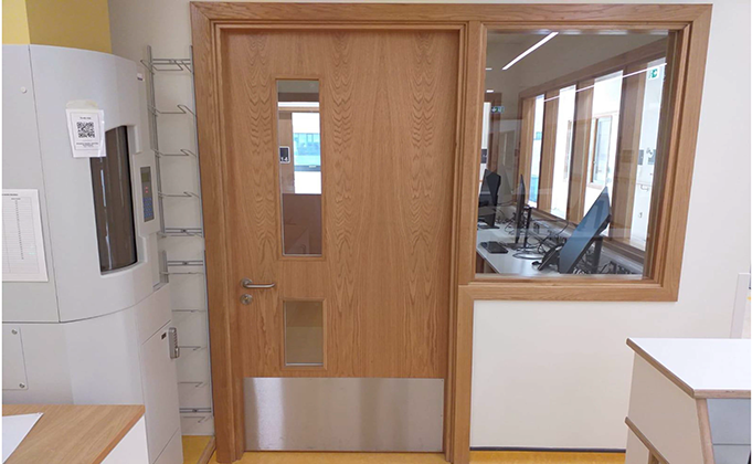 Timber fire door with vision panels and side screen