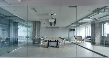 slim profile glass wall in office environment