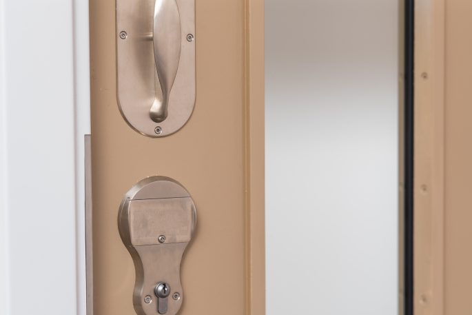 close up of anti ligature lever and lockset on door