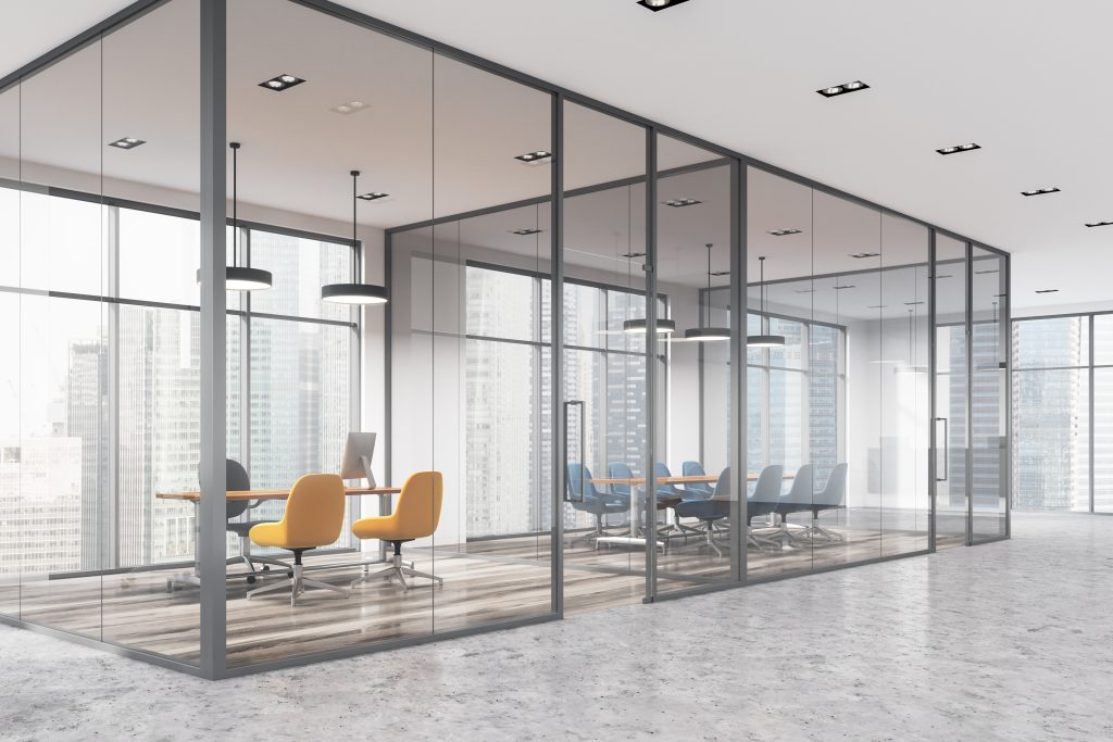 Glass-partition-panels-around-meeting-rooms-in-high-rise-office-setting