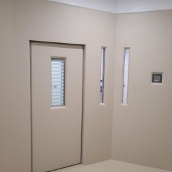 bespoke door with vision panel and bespoke glazed screens in mental health unit