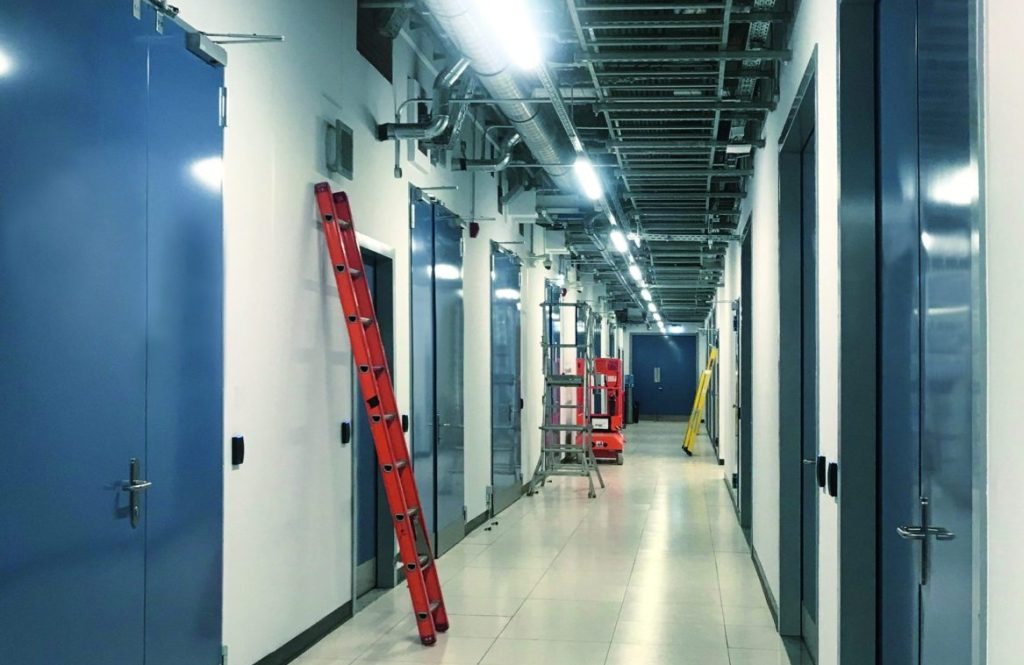 Corridor of steel doors in industrial building