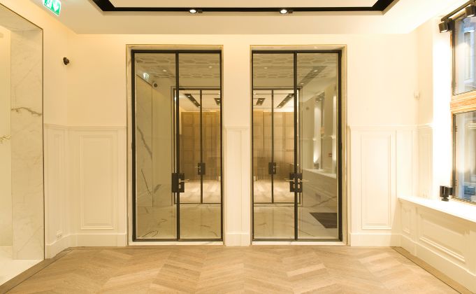 Double interior steel doorsets with full height glass panels