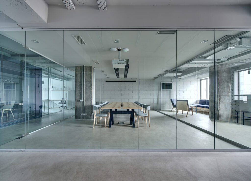 glass office wall or glazed partition to meeting room in modern office